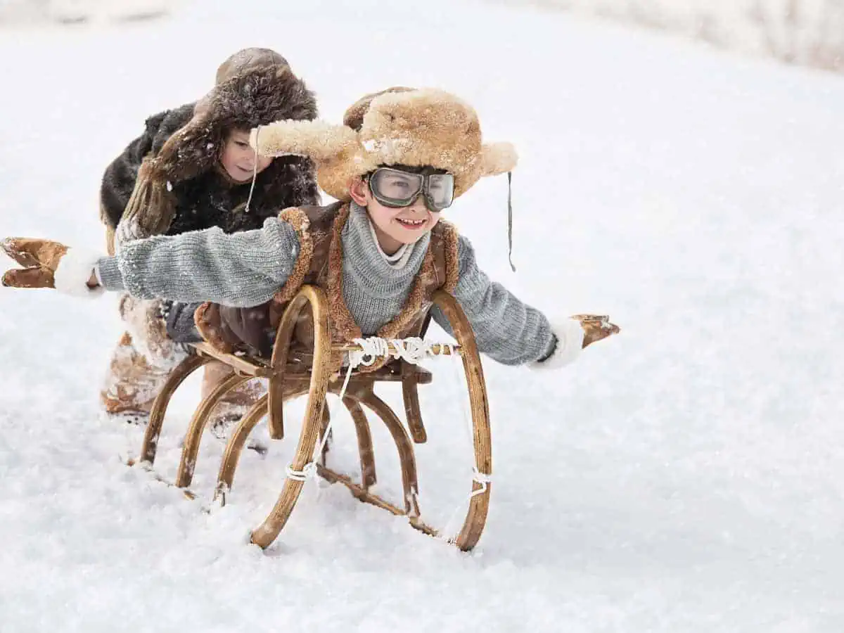 Photos of a child on a sled